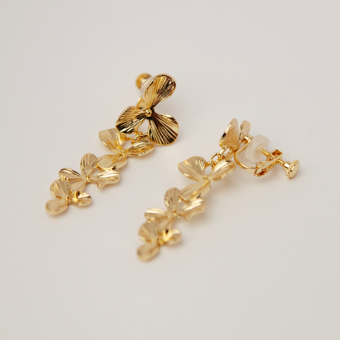 Gold Flower Dangle Clip On Earrings